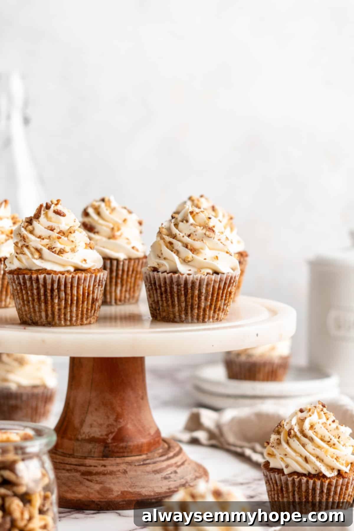 Vegan carrot cupcakes on cake stand