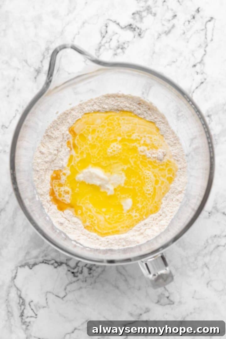Fluffy Vegan Japanese Milk Bread 12 Overhead view of wet bread ingredients added to well in center of dry ingredients