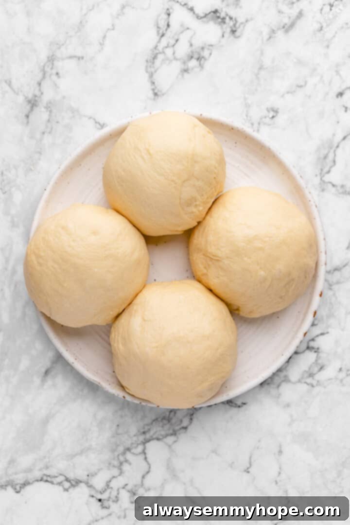 Fluffy Vegan Japanese Milk Bread 16 Four balls of bread dough on plate