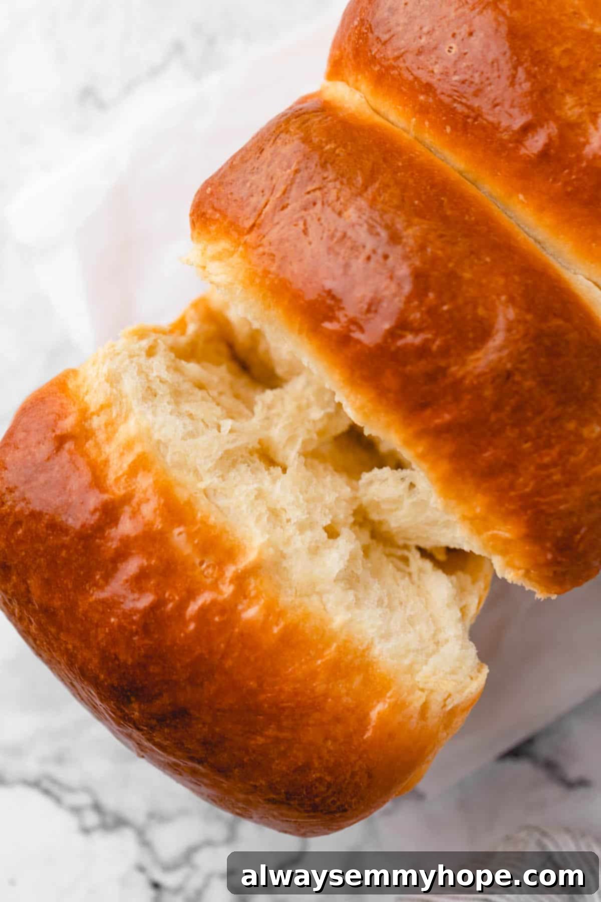 Fluffy Vegan Japanese Milk Bread 29 Pulling piece off of vegan milk bread to show inside