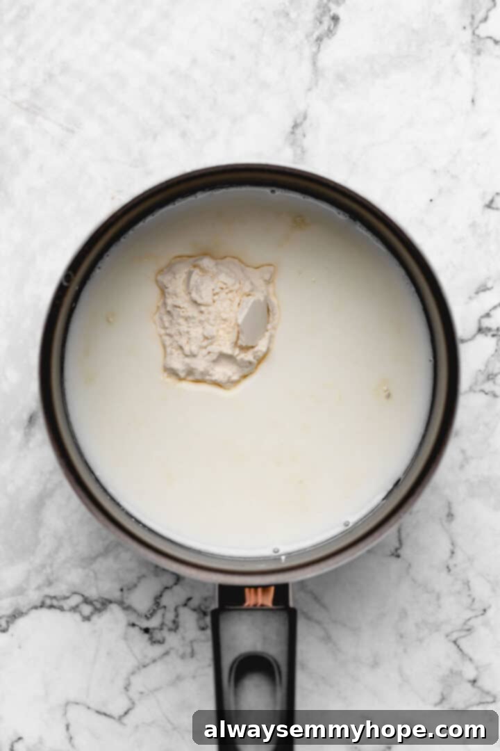 Fluffy Vegan Japanese Milk Bread 6 Overhead view of flour and soy milk in saucepan