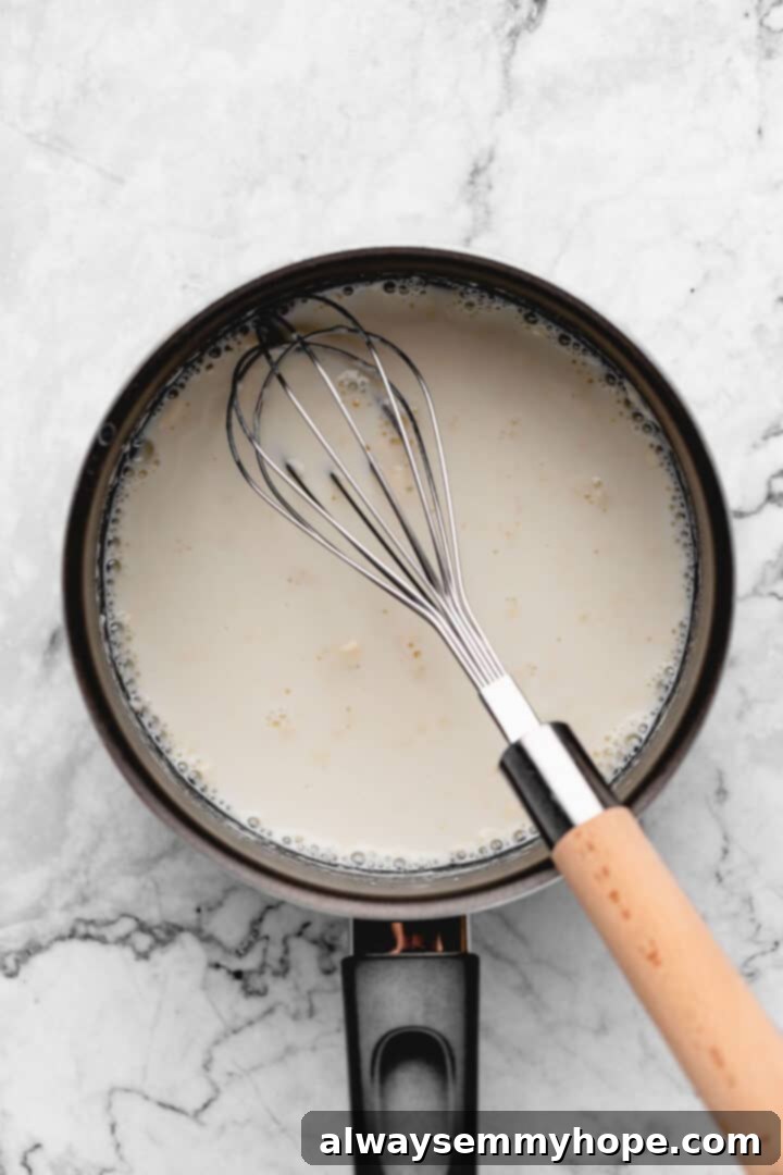 Fluffy Vegan Japanese Milk Bread 7 Overhead view of whisk in saucepan of tangzhong