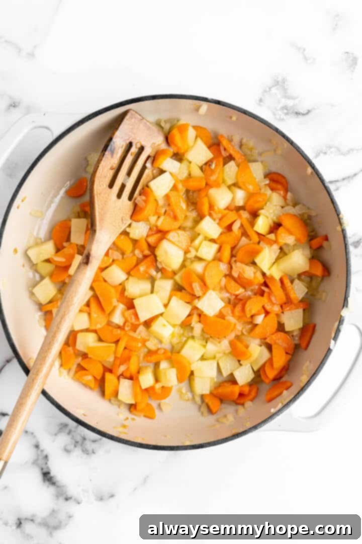 Carrots, potatoes, and onions in pan