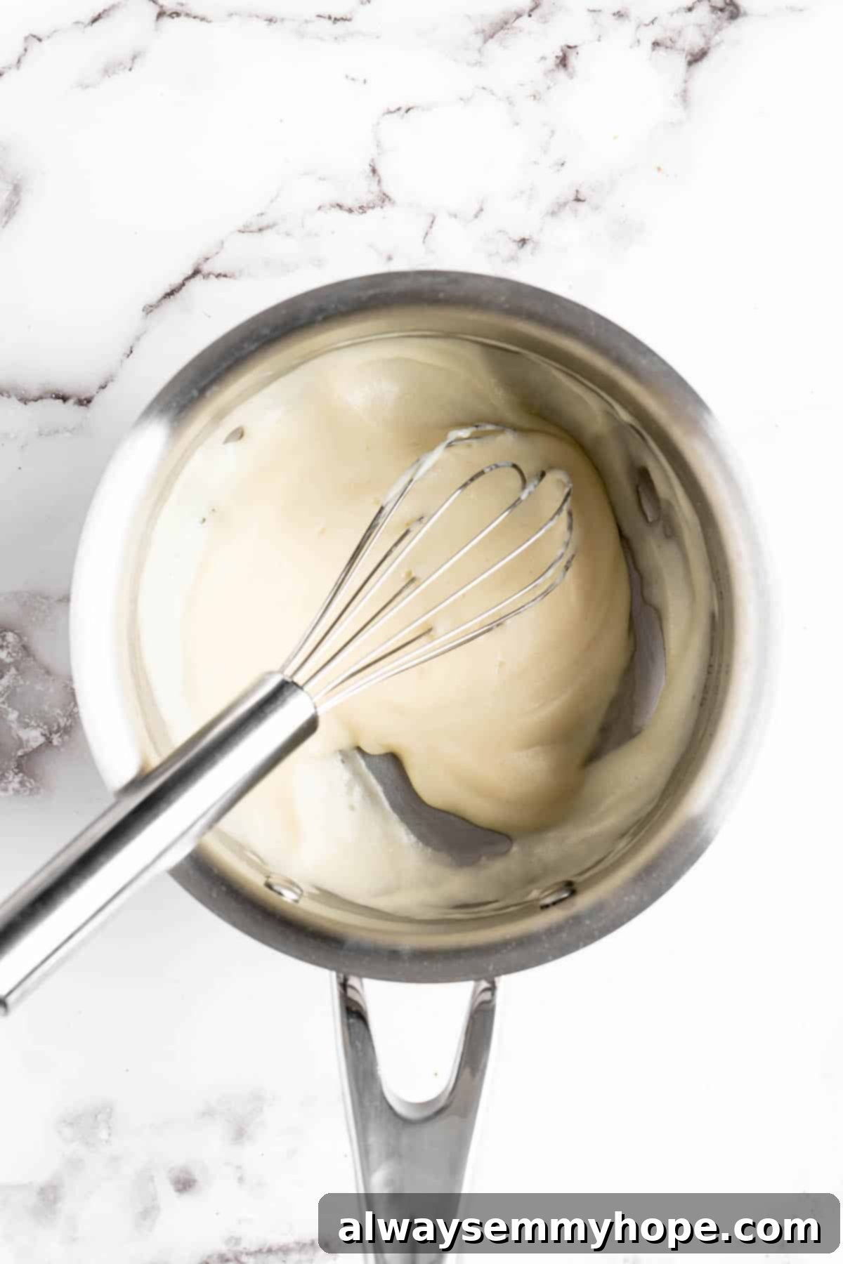 Whisking tangzhong mixture in a saucepan over heat
