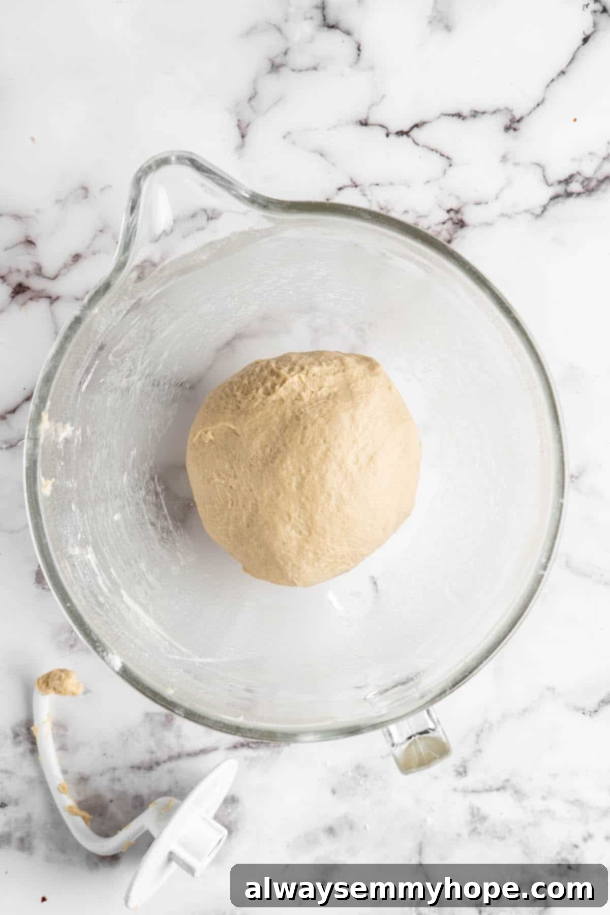 Vegan donut dough resting in a bowl before the first rise