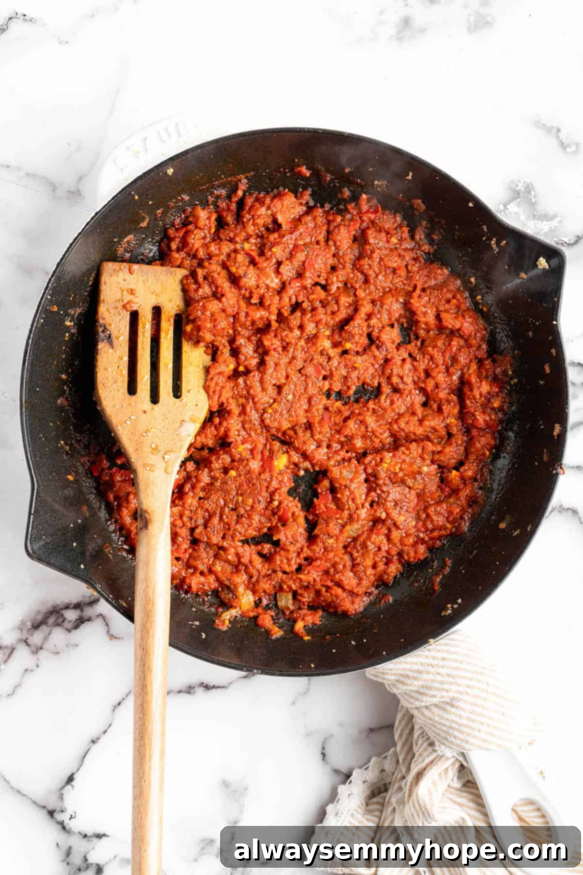 Homemade Chipotle Sofritas 7 Vibrant red sofrito sauce simmering in a cast iron skillet