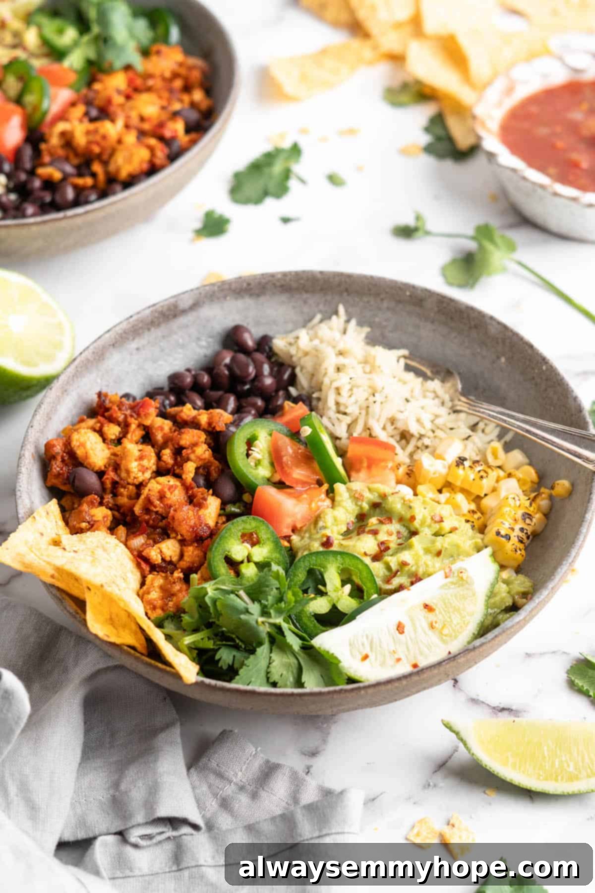 Homemade Chipotle Sofritas 10 Burrito bowl featuring vibrant vegan sofritas, rice, corn, and avocado slices