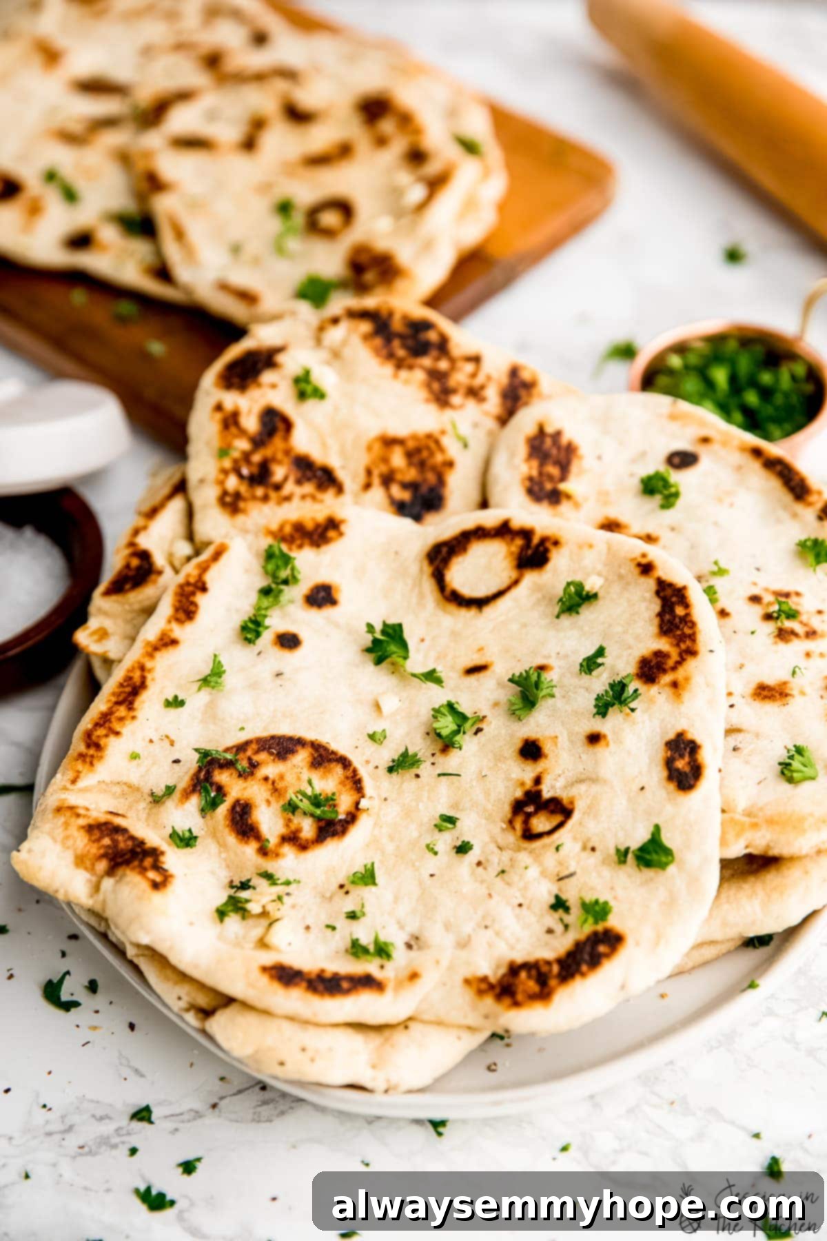 Delicious Homemade Vegan Naan 13 A beautiful pile of easy vegan naan on a plate, ready to be enjoyed.