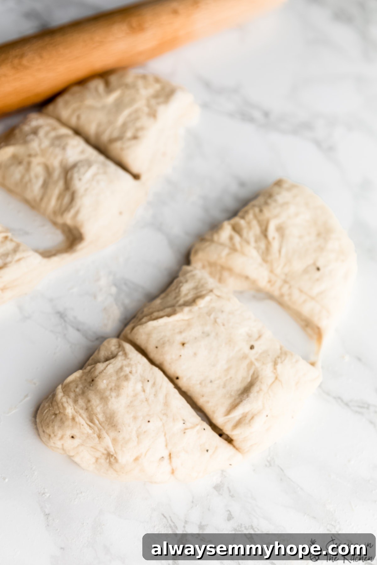 Delicious Homemade Vegan Naan 8 A semi-circle of divided vegan naan dough portions on a countertop.