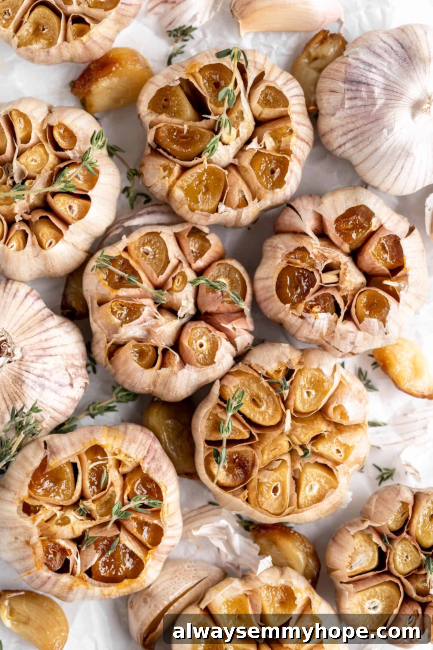 Air fryer roasted garlic garnished with sprigs of thyme