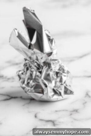 Garlic head wrapped in foil