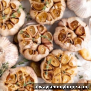 Air fryer roasted garlic garnished with sprigs of thyme