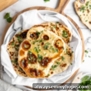 Garlic Naan: Plant-Based Perfection 2 Stack of garlic naan in towel-lined bowl
