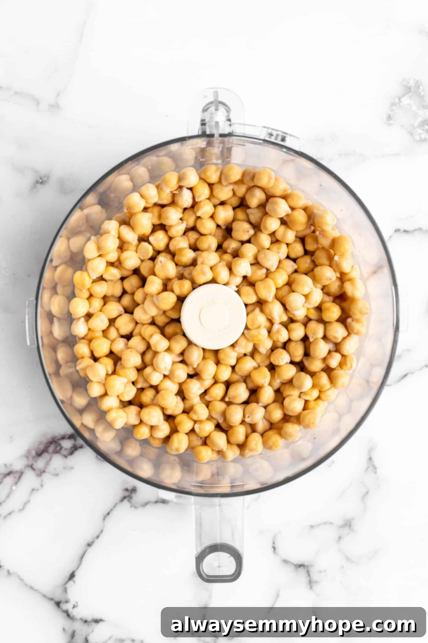 This homemade falafel recipe is just like the kind they make at restaurants. Fluffy on the inside, crispy on the outside, and so delicious! Chickpeas in food processor