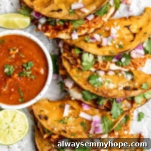 Plant-Based Birria Tacos 2 Overhead view of vegan birria tacos with bowl of birria sauce