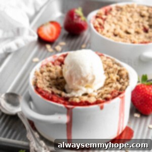 No-Fuss Five-Ingredient Strawberry Crumble 2 Strawberry crumble in ramekin with vanilla ice cream scoop on top