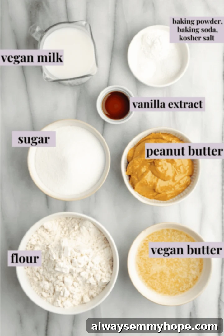 A bowl containing a creamy mixture of wet ingredients for vegan peanut butter cake, including milk, melted vegan butter, and peanut butter, ready for dry ingredients.