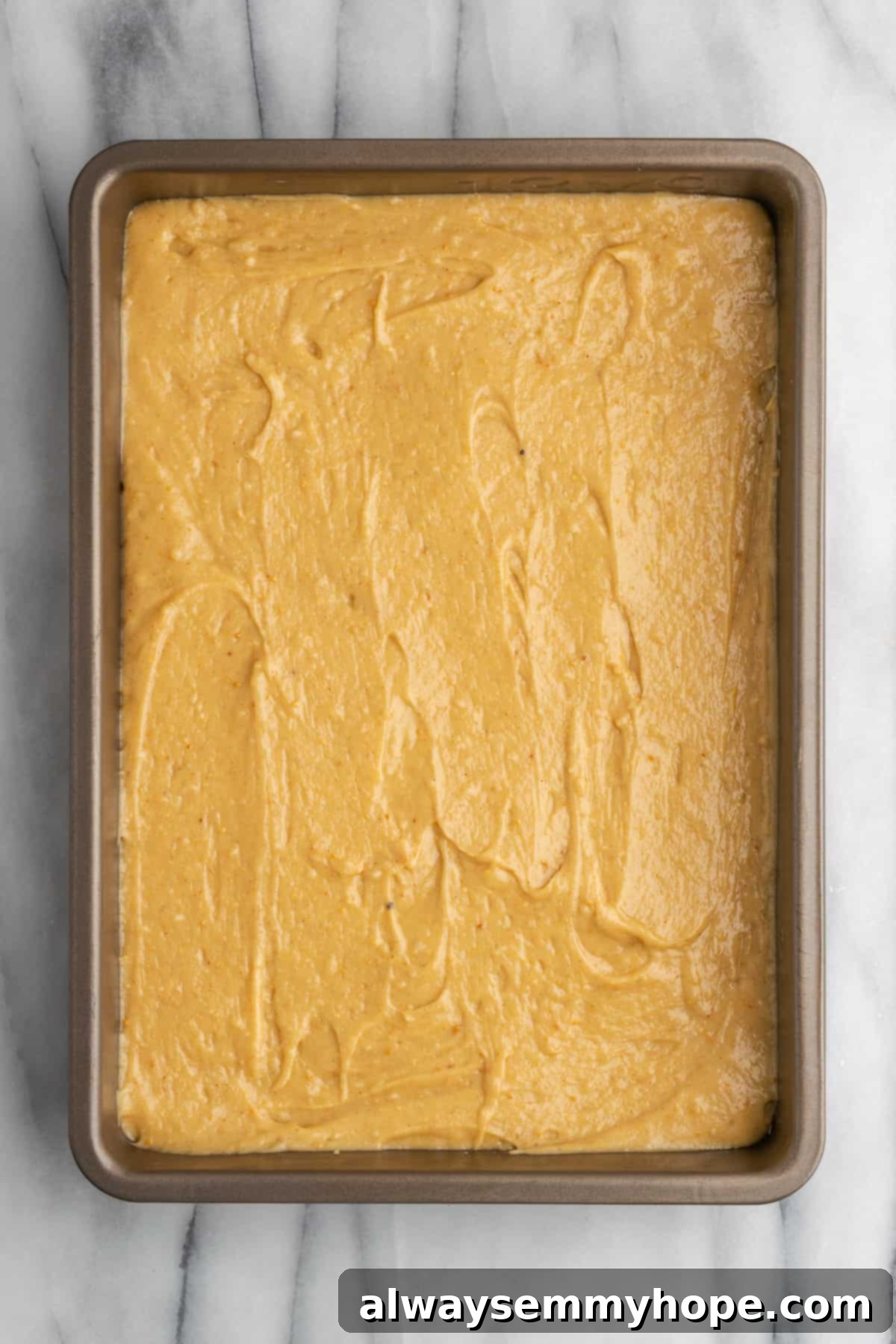 A fully frosted vegan peanut butter cake adorned with chopped peanuts, beautifully presented and ready to be sliced and enjoyed.