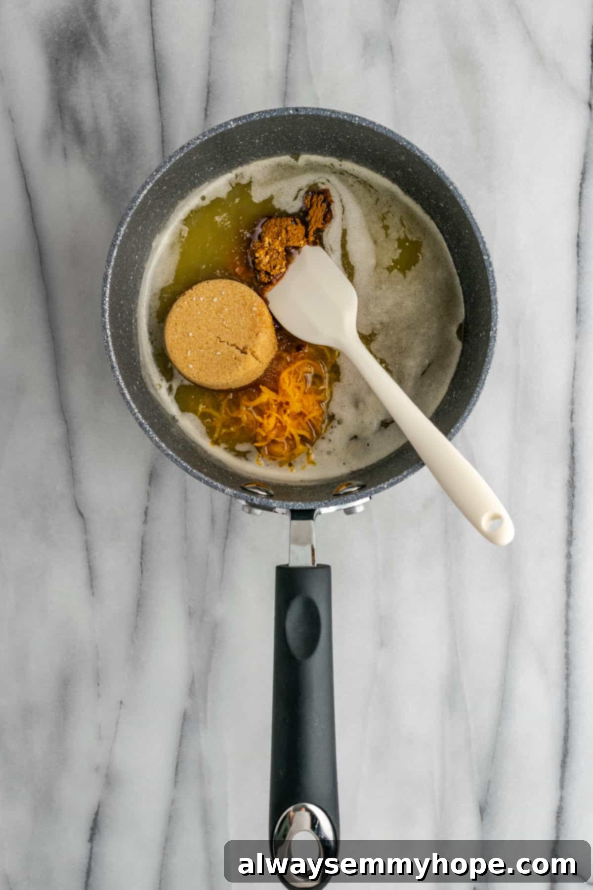 All ingredients for the candied yam sauce in a saucepan, ready to be stirred. All the dry and liquid ingredients for the candied yam sauce gathered in a saucepan before mixing.