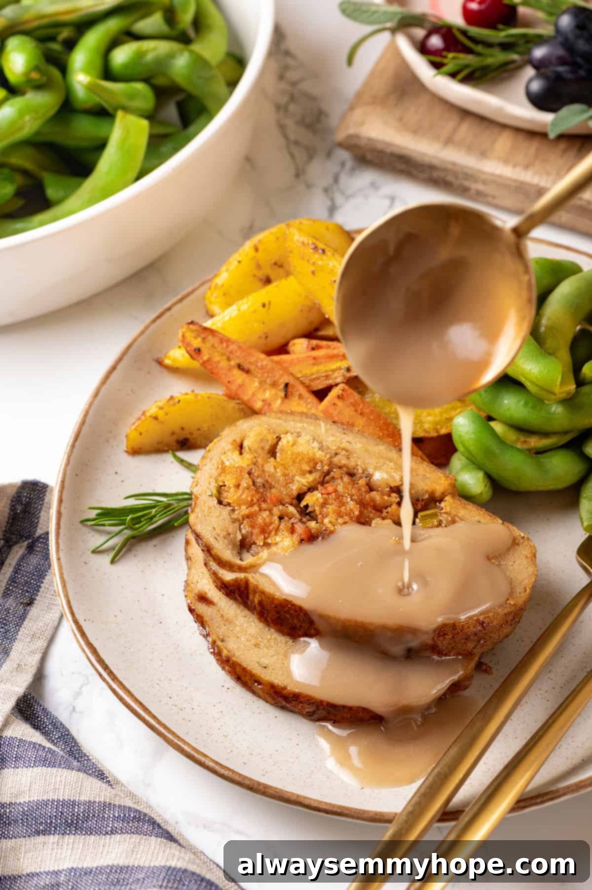 This homemade vegan turkey recipe is supremely flavourful and the perfect addition to any Thanksgiving table or holiday dinner! Ladling gravy over slices of vegan turkey on plate