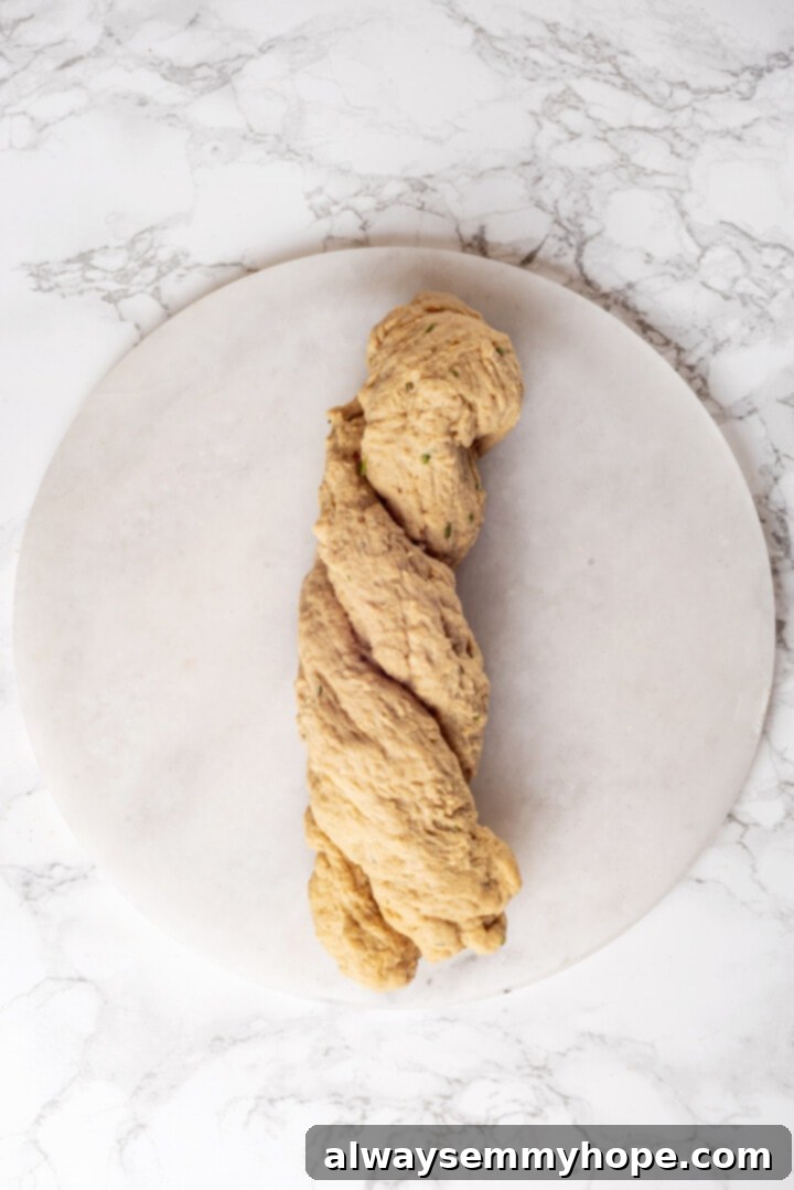 This homemade vegan turkey recipe is supremely flavourful and the perfect addition to any Thanksgiving table or holiday dinner! Overhead view of vegan turkey twisted into rope