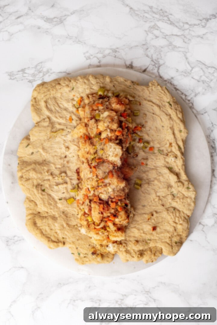 This homemade vegan turkey recipe is supremely flavourful and the perfect addition to any Thanksgiving table or holiday dinner! Overhead view of vegan stuffing in turkey