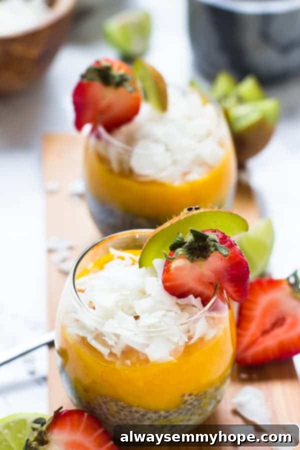 A wine glass with chia seeds in the bottom and mango pudding on top.