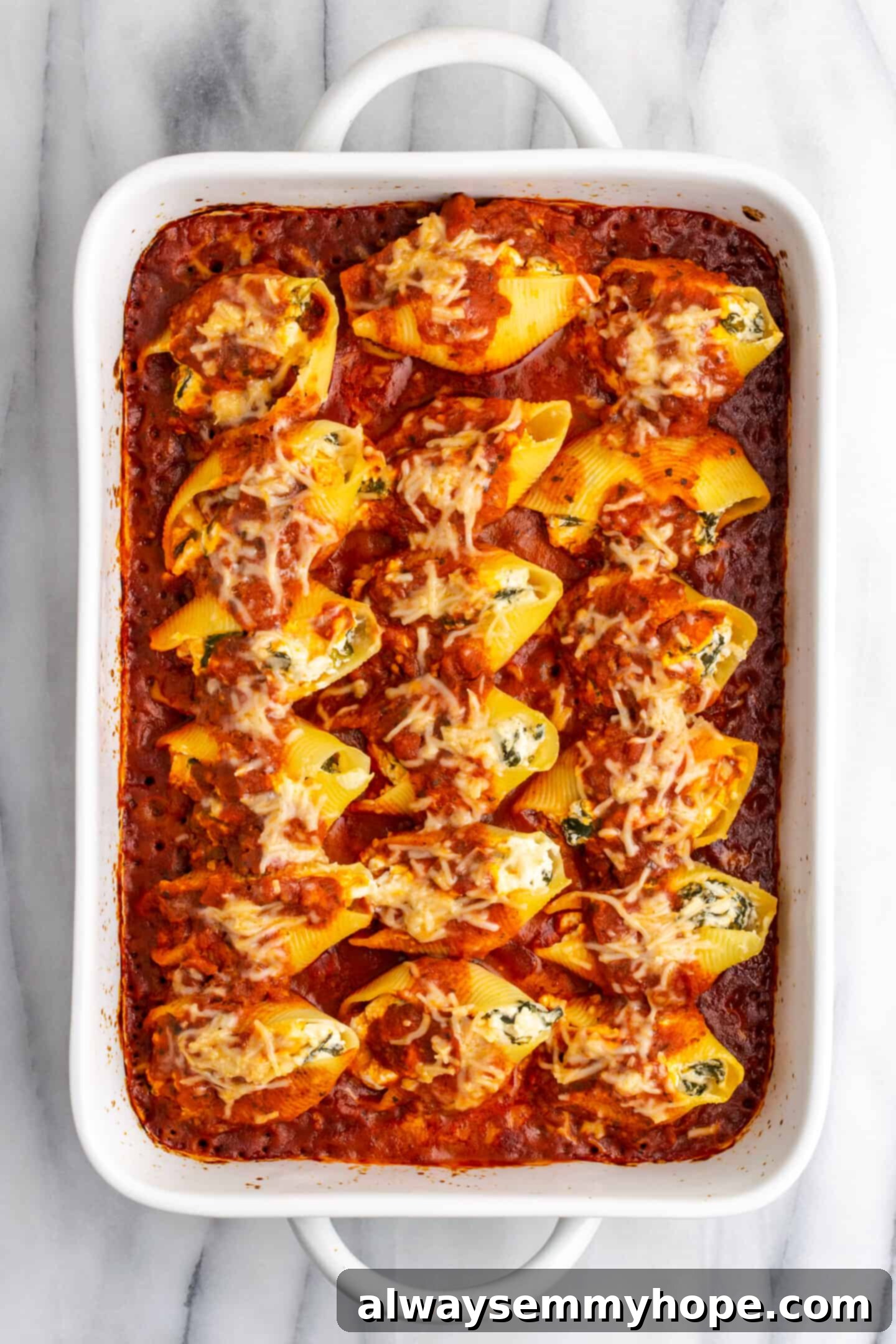 Creamy Vegan Stuffed Shells 15 Baked vegan stuffed shells in a casserole dish, golden and bubbly