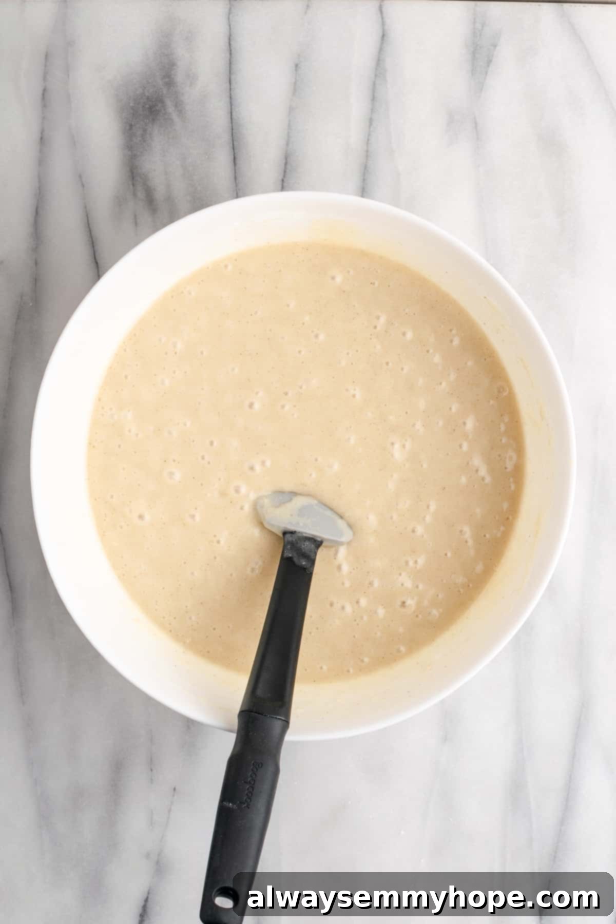 Tropical Vegan Coconut Cake 8 Another view of the vegan coconut cake batter, illustrating its ideal consistency before baking.
