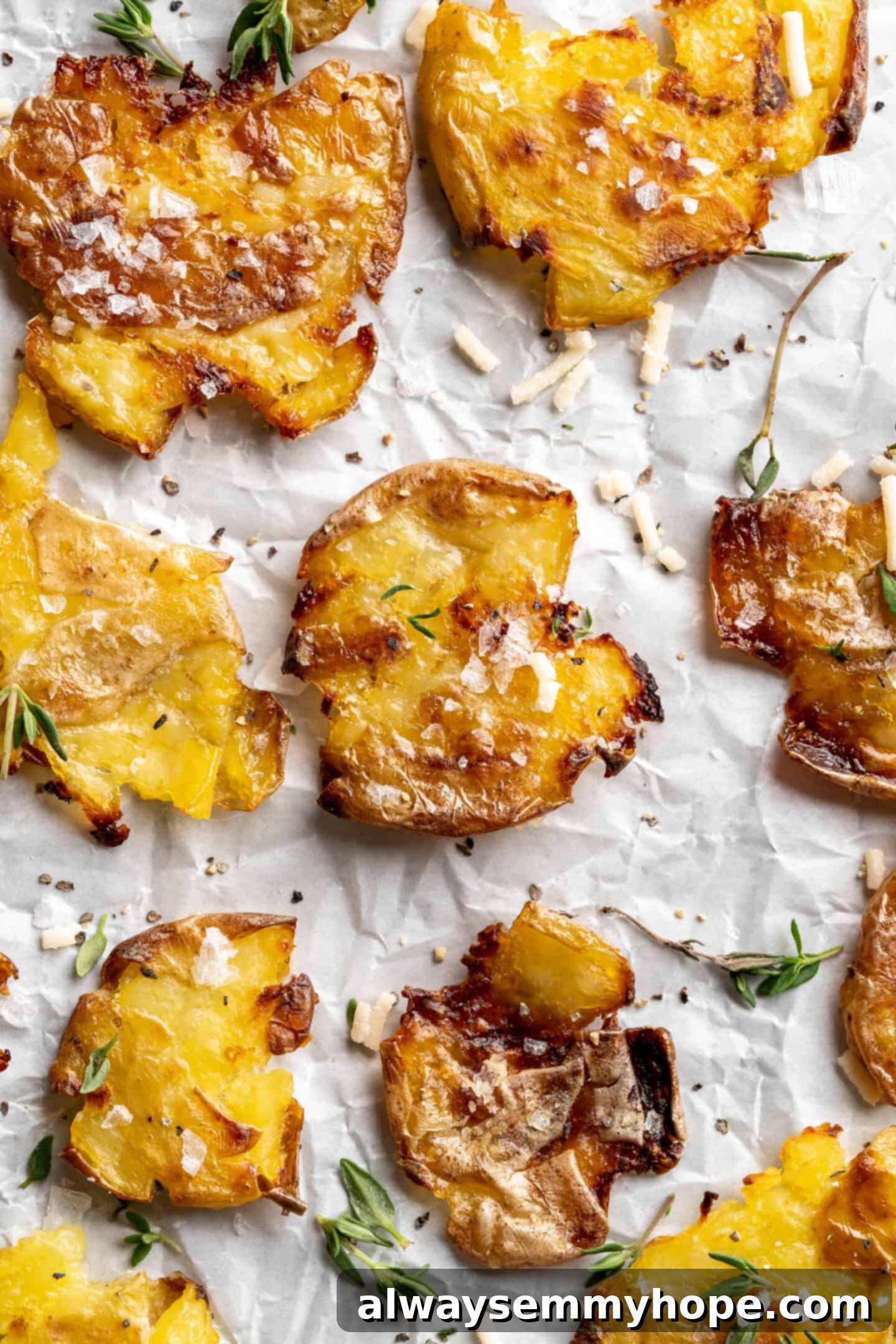 Close up of crispy smashed potatoes on a sheet pan, ready for enjoyment