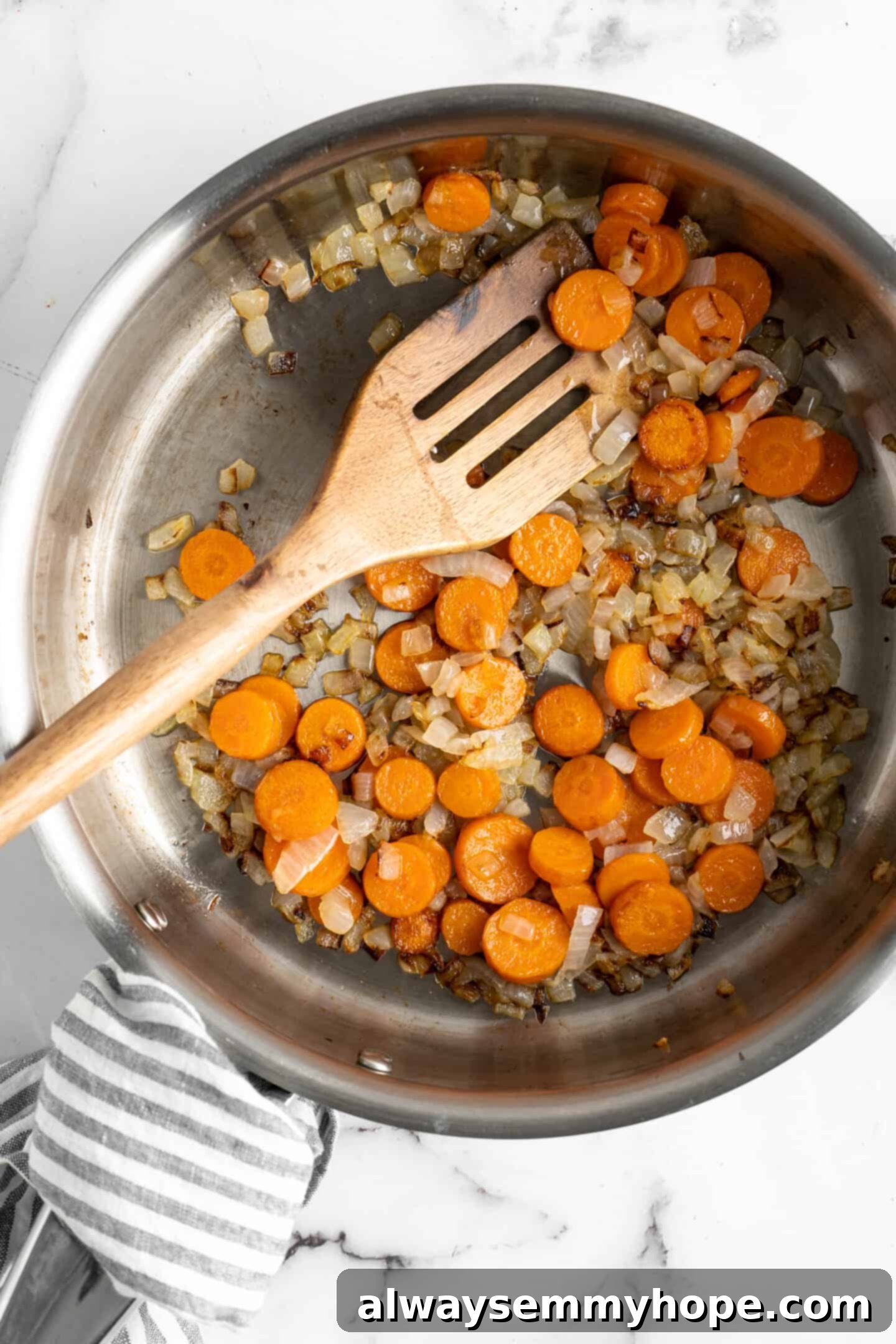 sauteing carrots and onions Sauteing carrots, onions, and garlic to make vegan queso