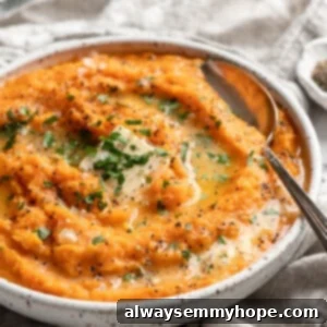 Velvety Sweet Potato Mash 2 mashed sweet potatoes with vegan butter melted into the top