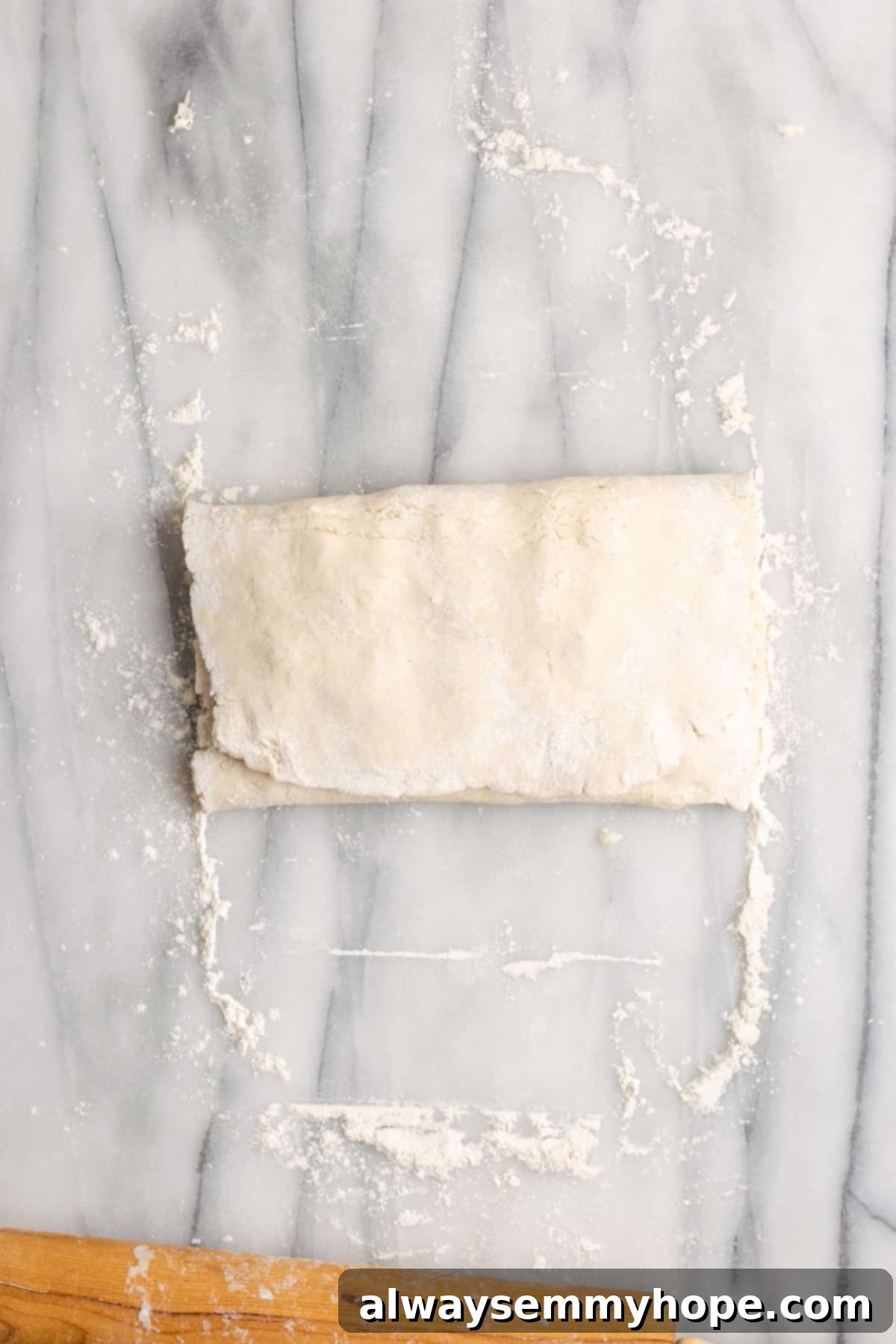 Dough filled with shredded butter, folded into an envelope