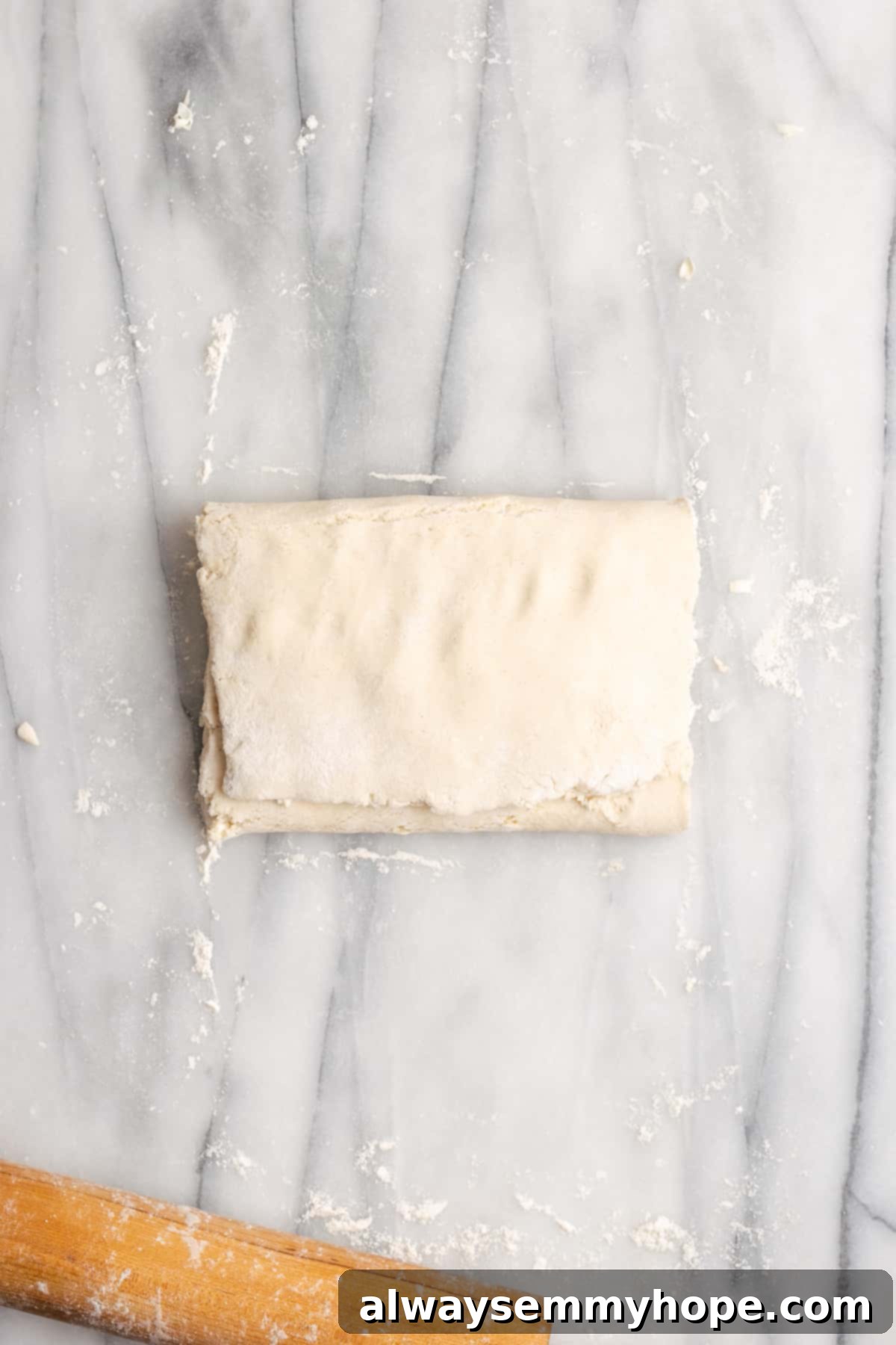 Dough filled with shredded butter, folded into an envelope