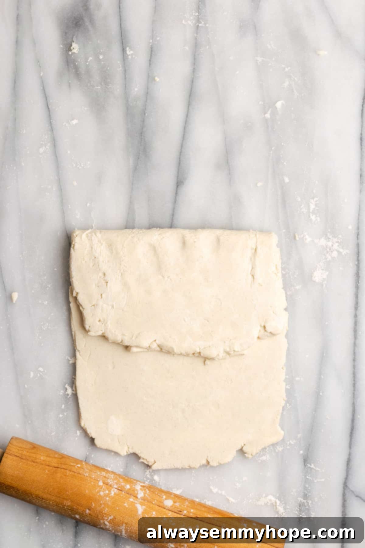 A thick rectangle of dough with one side folded over