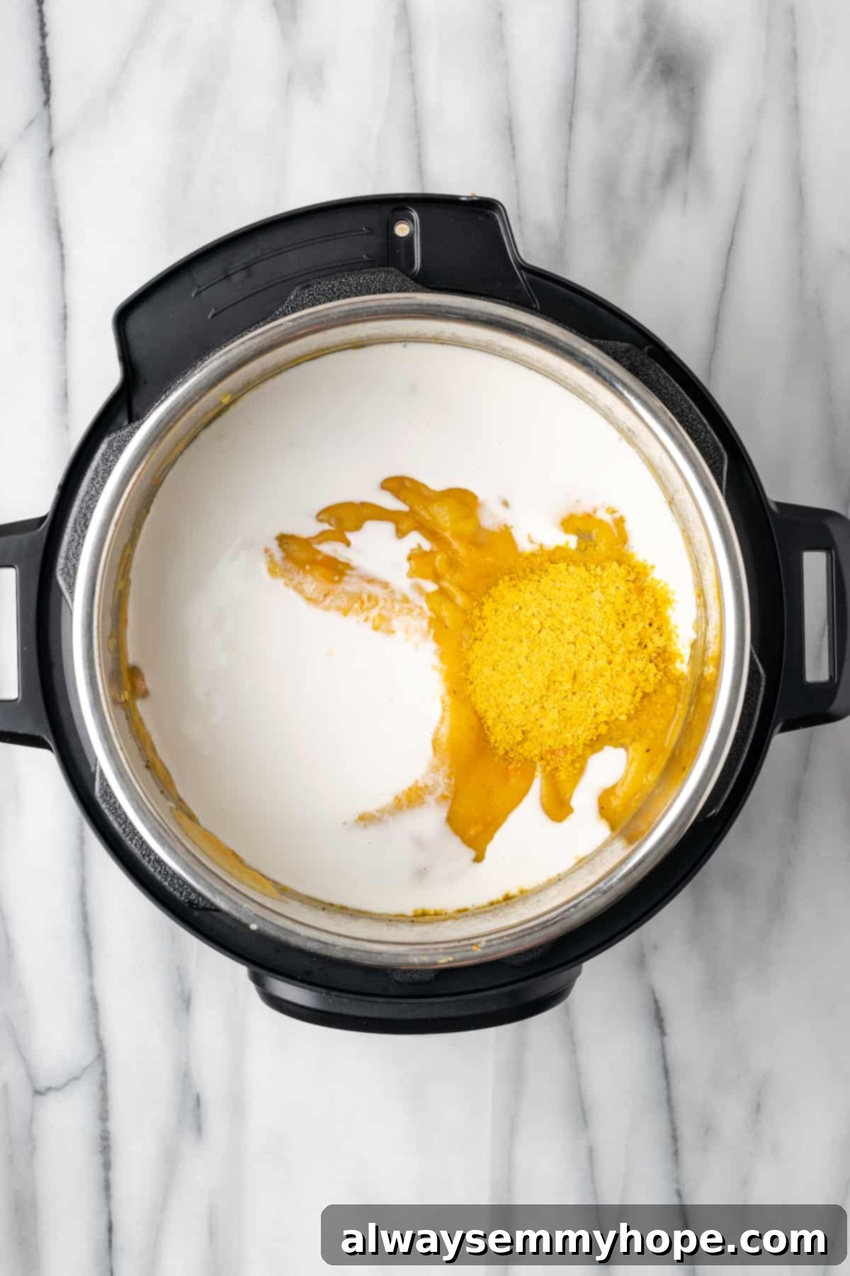 This creamy vegan Instant Pot potato soup recipe is hearty, comforting, and perfect for winter, plus it's easy and quick to make! A splash of vegan milk being poured into the blended potato soup in the Instant Pot, adding to its creaminess.