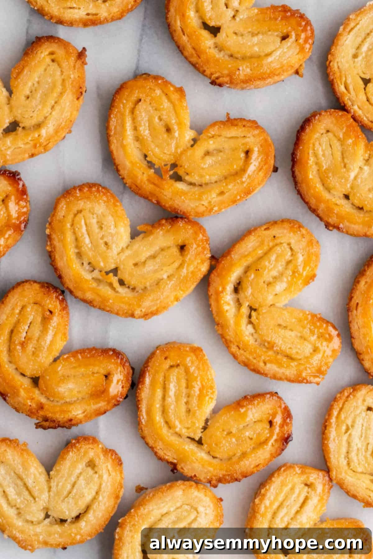 A bunch of puff pastry palmiers next to each other