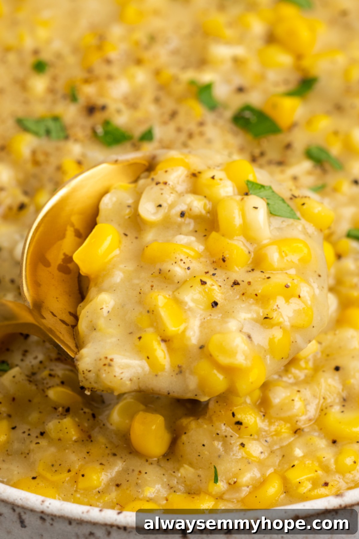 Spoonful of vegan creamed corn in bowl