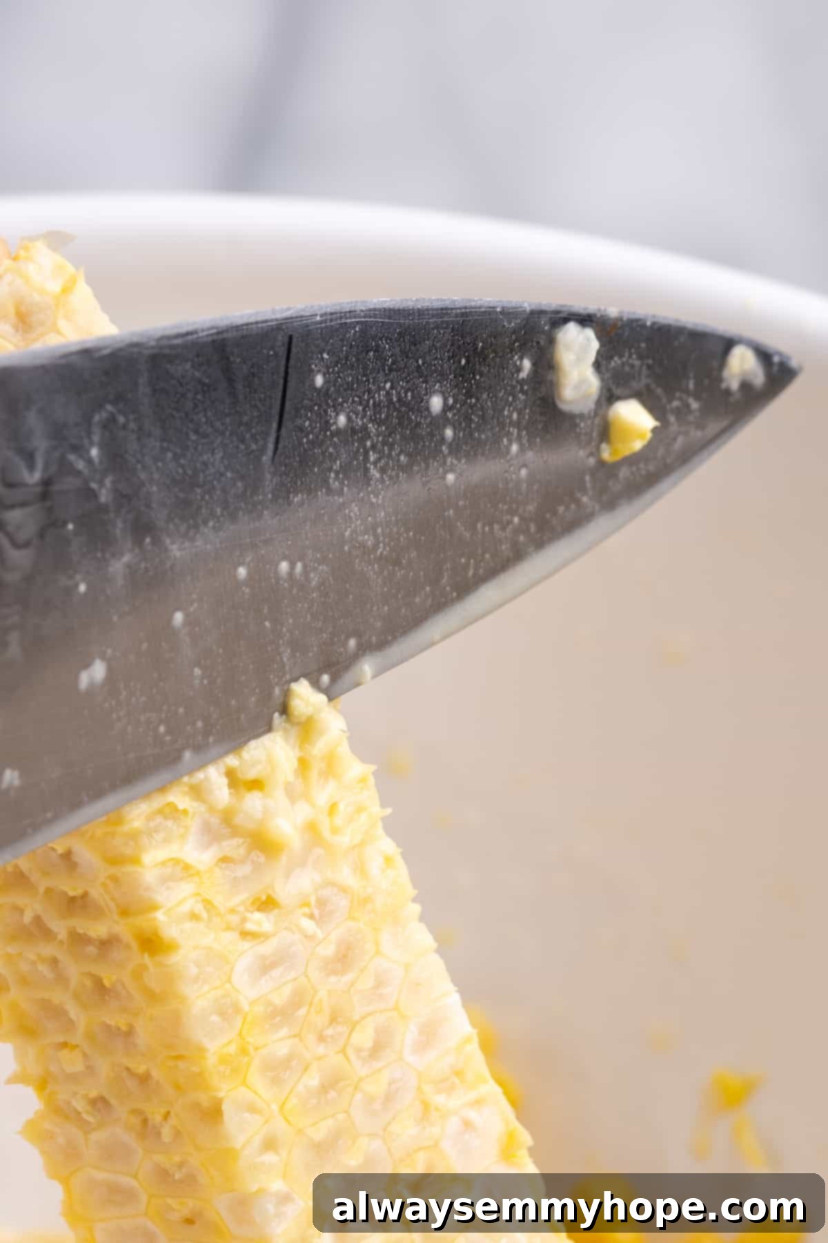 Knife milking ear of corn