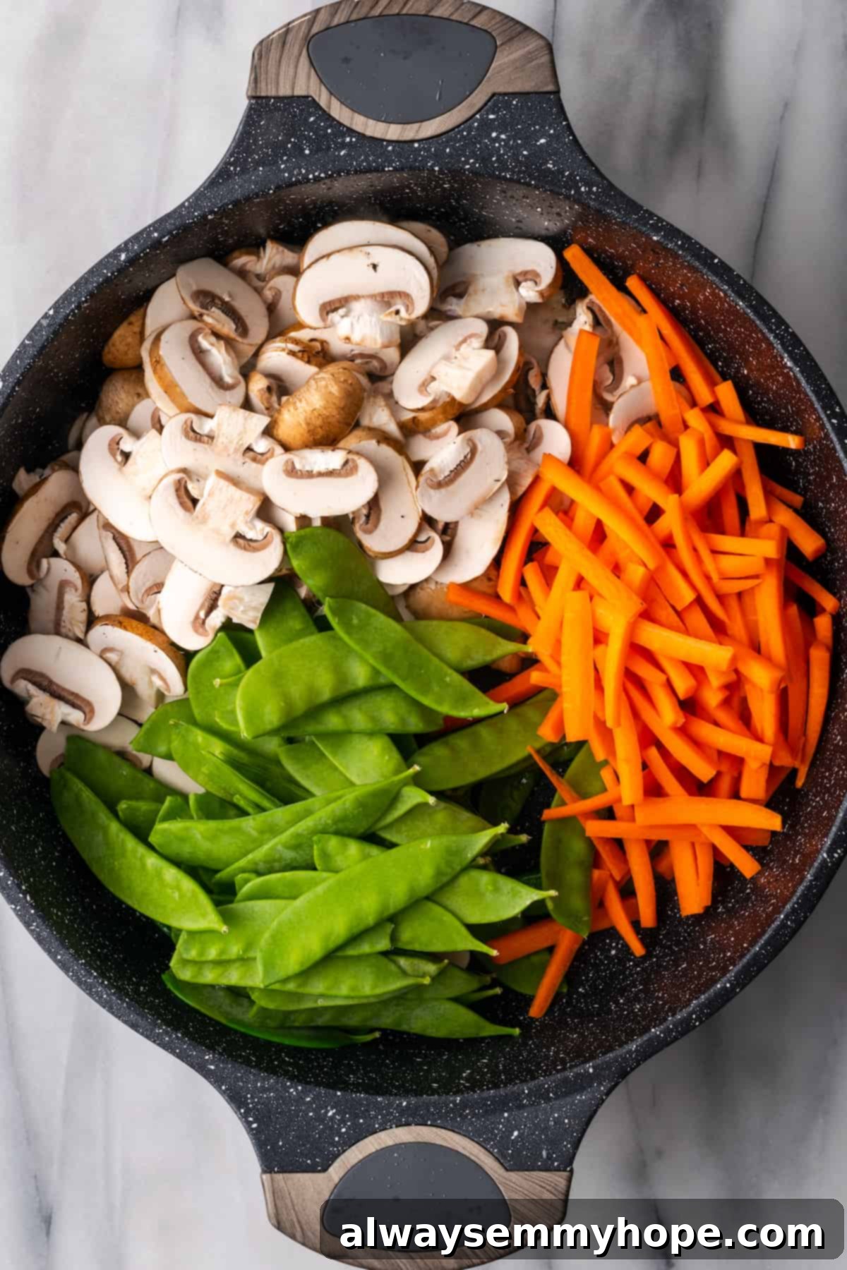 Vibrant vegetables ready for stir-frying in the pan for the ultimate vegan Chow Fun. Overhead view of fresh carrots, mushrooms, and snow peas in a hot pan before stir-frying.