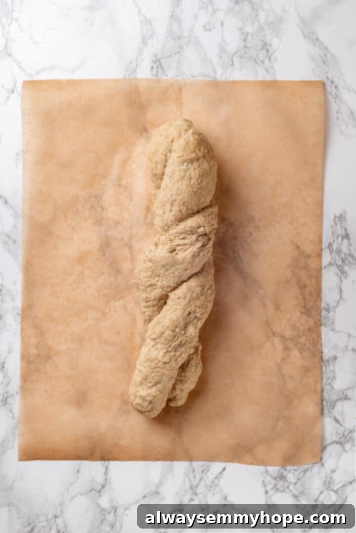 The vegan chicken dough twisted into a rope, showcasing the developed texture.