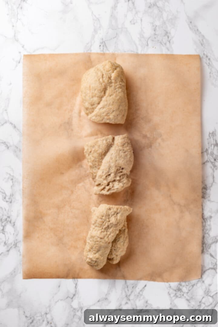 The twisted vegan chicken dough cut into three equal pieces, ready for final shaping.