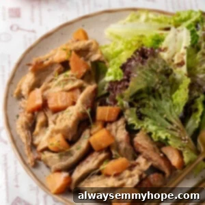 Vegan chicken on plate with salad and roasted carrots