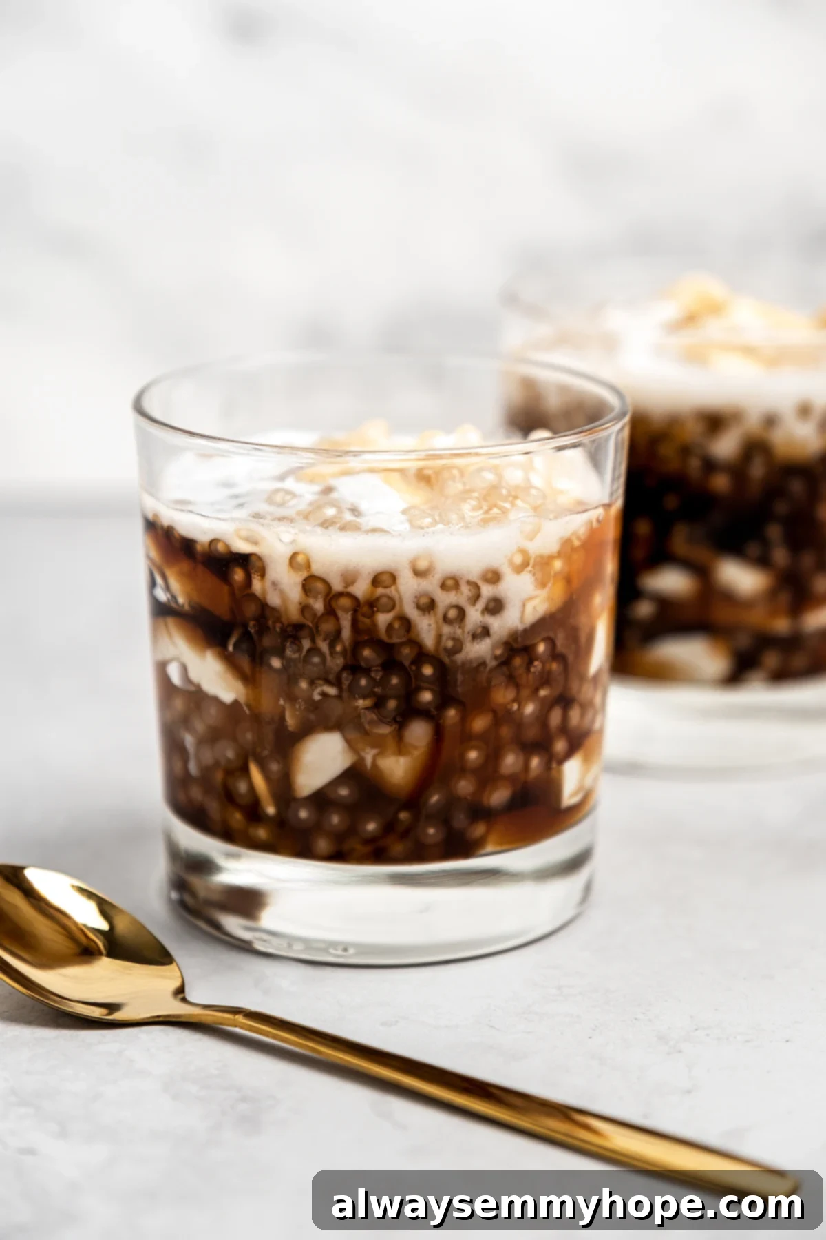 Two glasses of taho with gold spoon