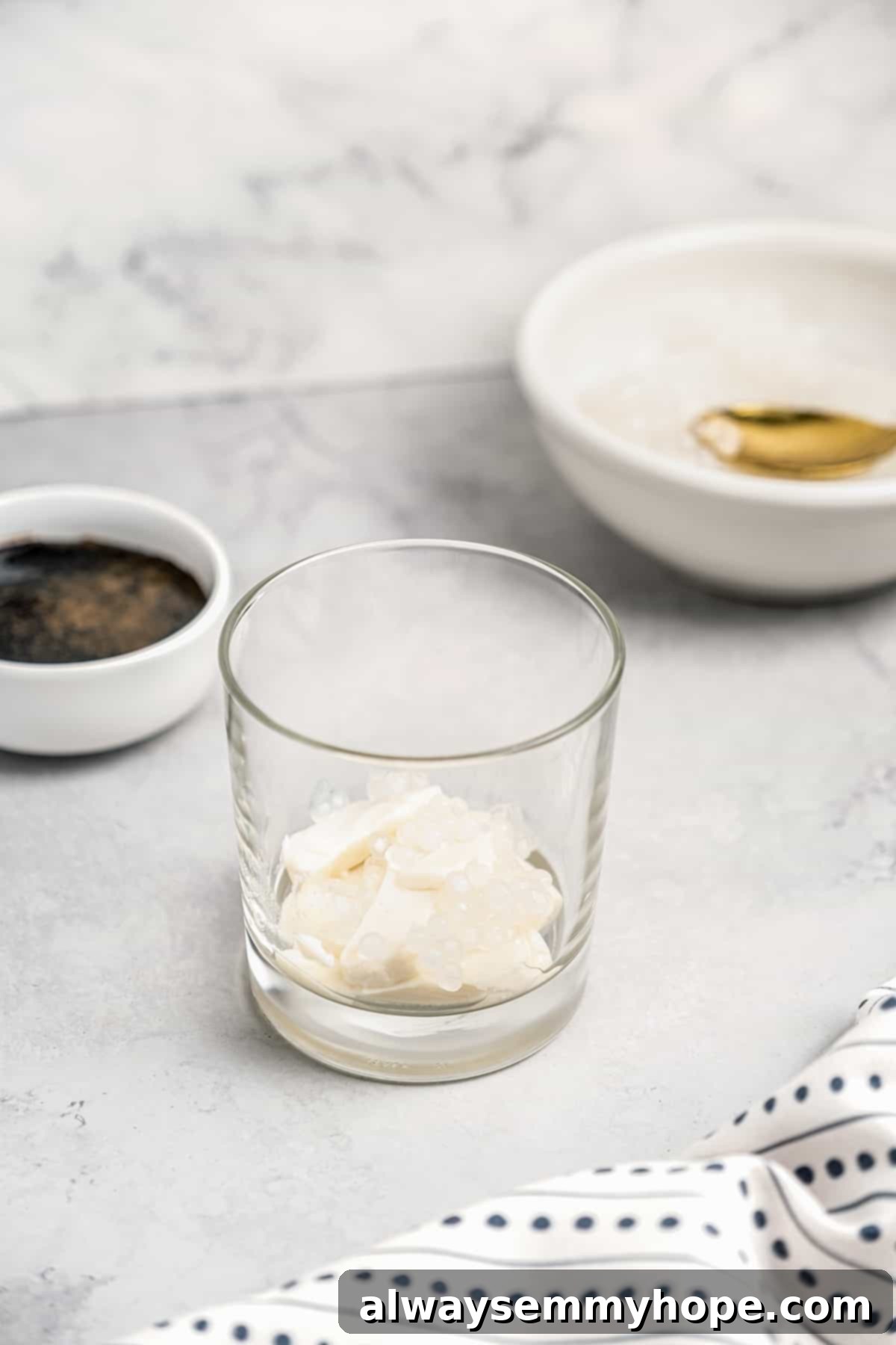 Silken tofu slices in bottom of glass