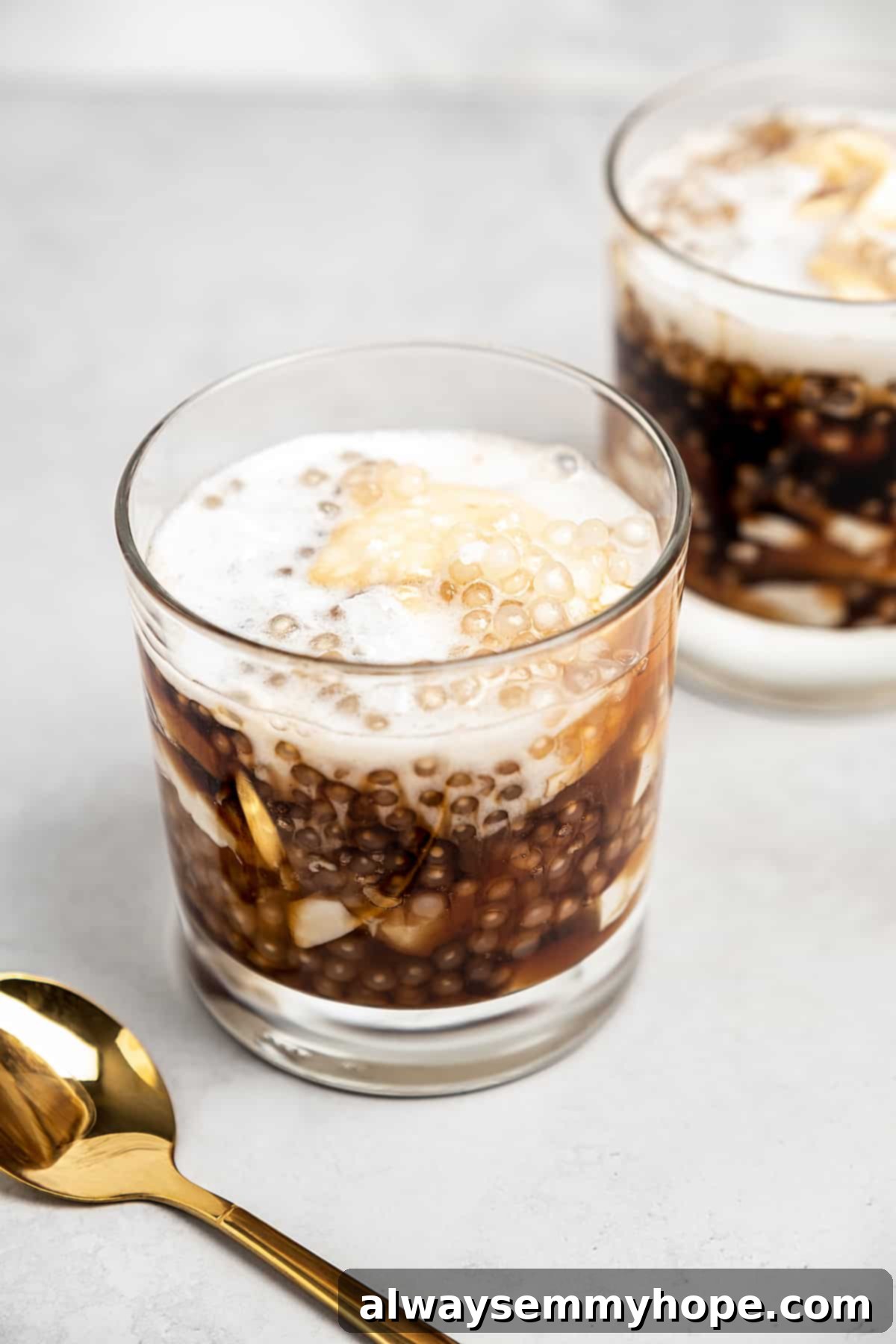 Two glasses of taho with gold spoon
