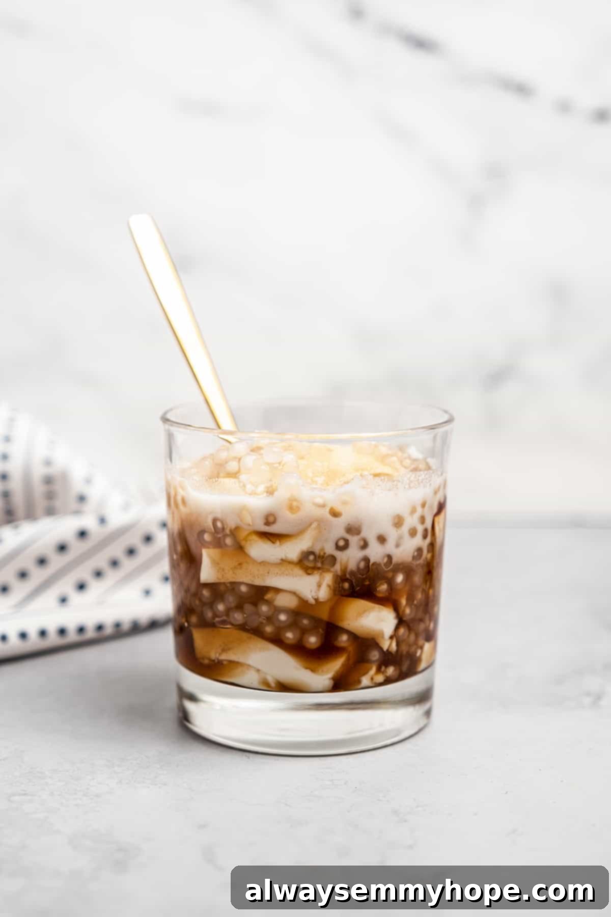 Filipino taho in glass with gold spoon