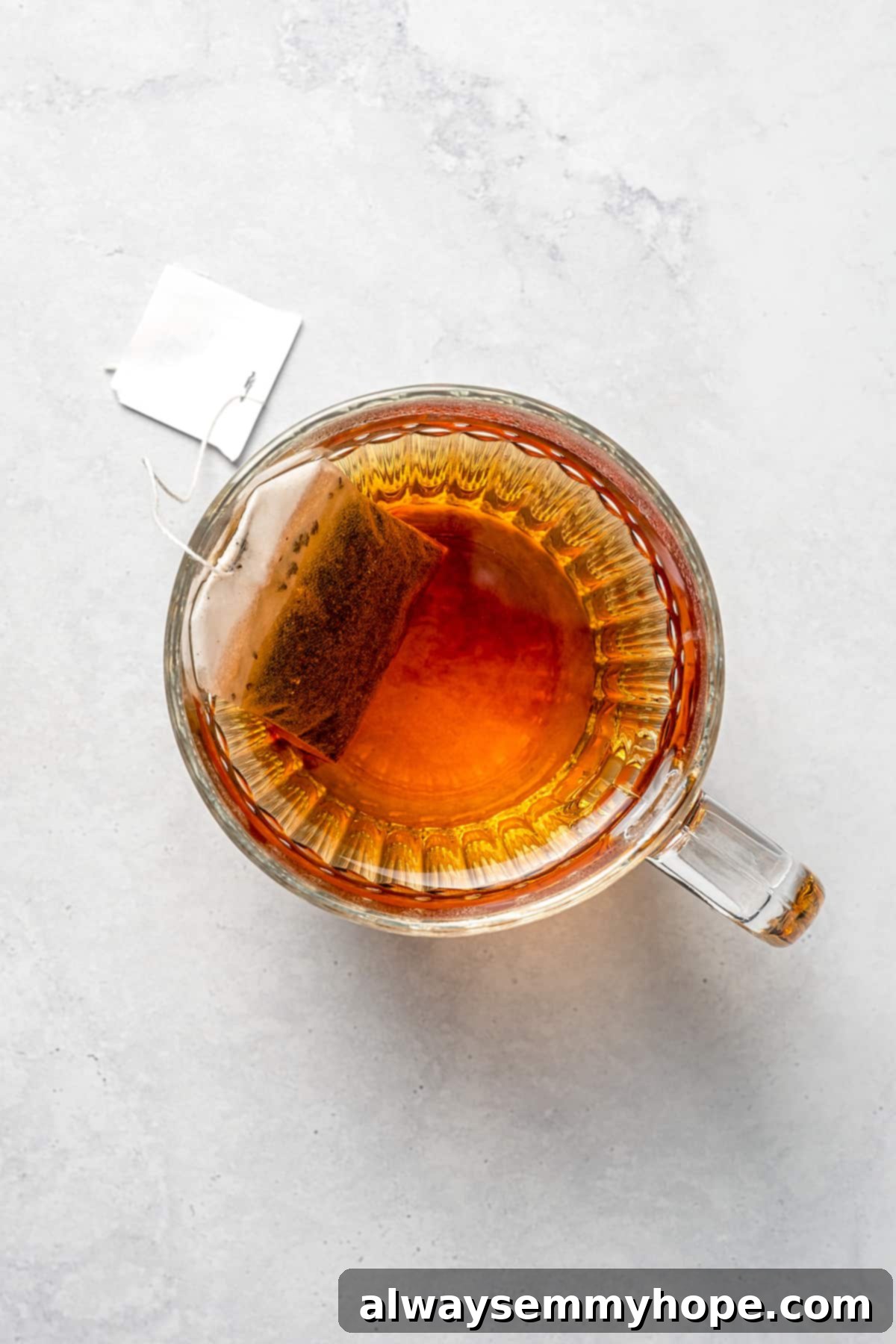 Tea brewing in glass cup