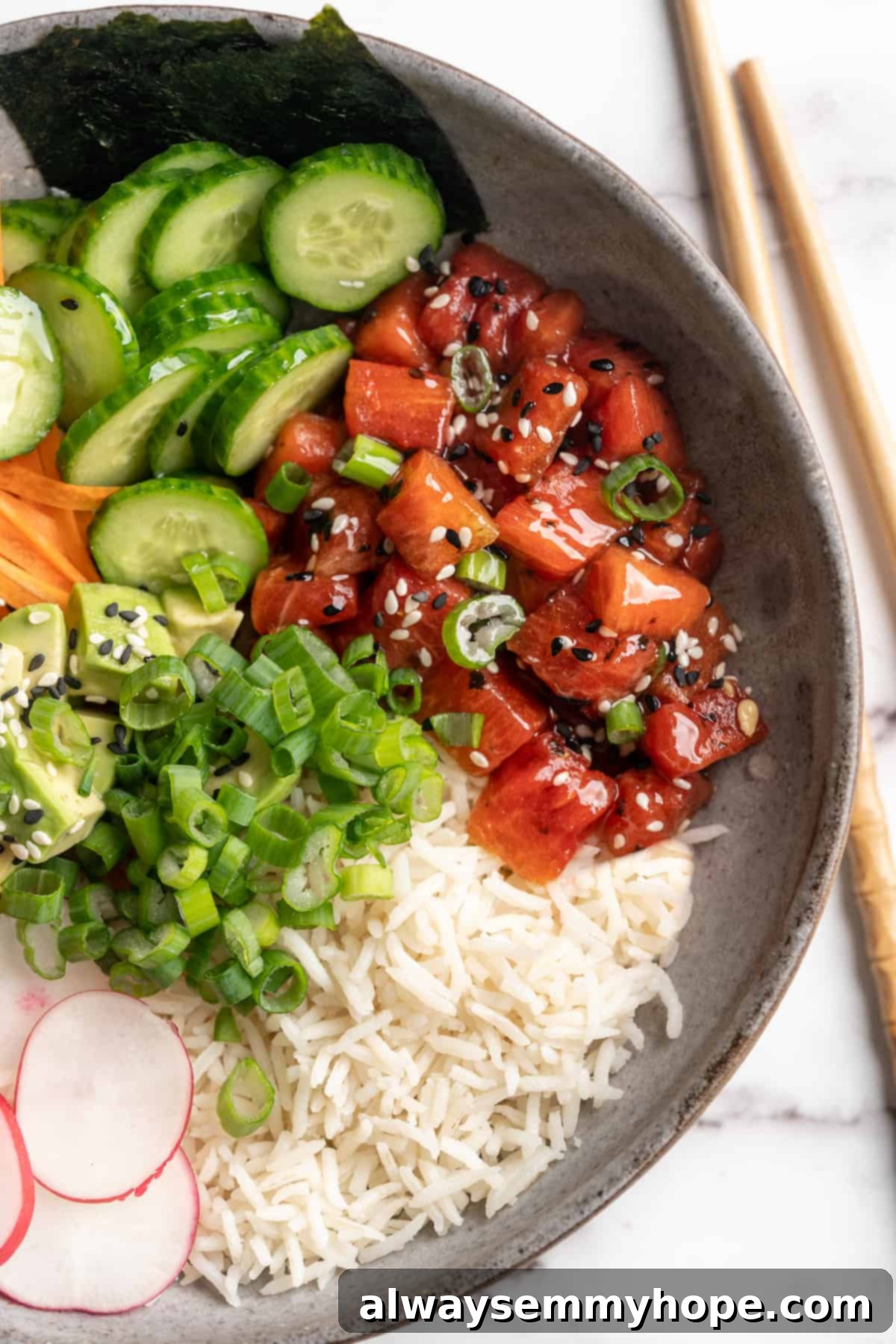 Craft incredible vegan poke bowls with ease, using this transformative watermelon tuna recipe that delivers a taste remarkably close to traditional ahi. A beautifully arranged vegan poke bowl featuring vibrant watermelon tuna as the star, alongside fresh avocado, edamame, and seasoned sushi rice.