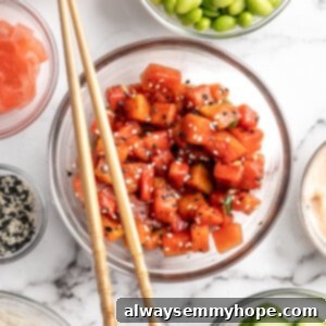Watermelon Tuna Unveiled 2 Overhead view of vegan watermelon tuna in glass bowl with other poke ingredients